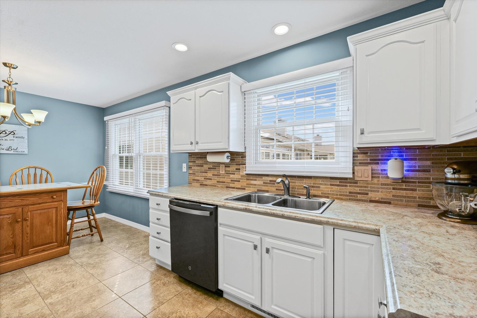 2523 Windward Boulevard, Unit 2523 Champaign, IL 61821 - Photo 11 of 26 a kitchen with stainless steel appliances granite countertop a stove a sink and a refrigerator
