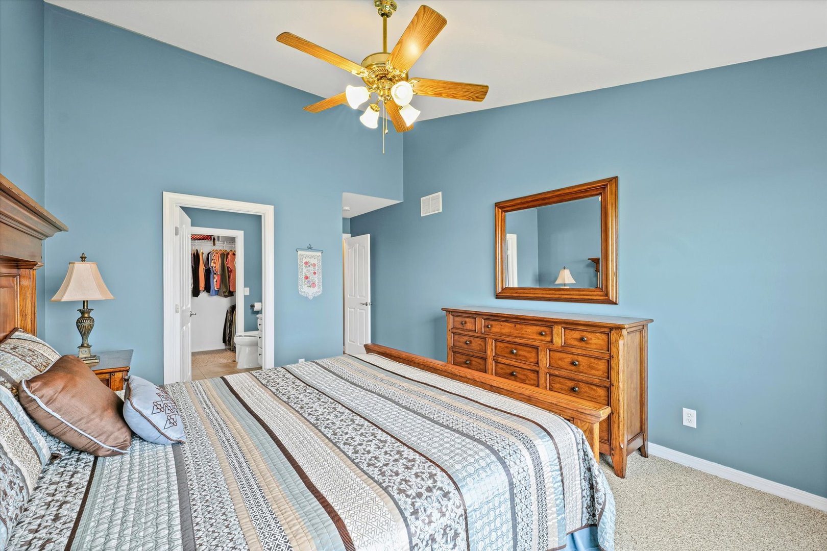 2523 Windward Boulevard, Unit 2523 Champaign, IL 61821 - Photo 14 of 26 a bedroom with a bed and a chandelier