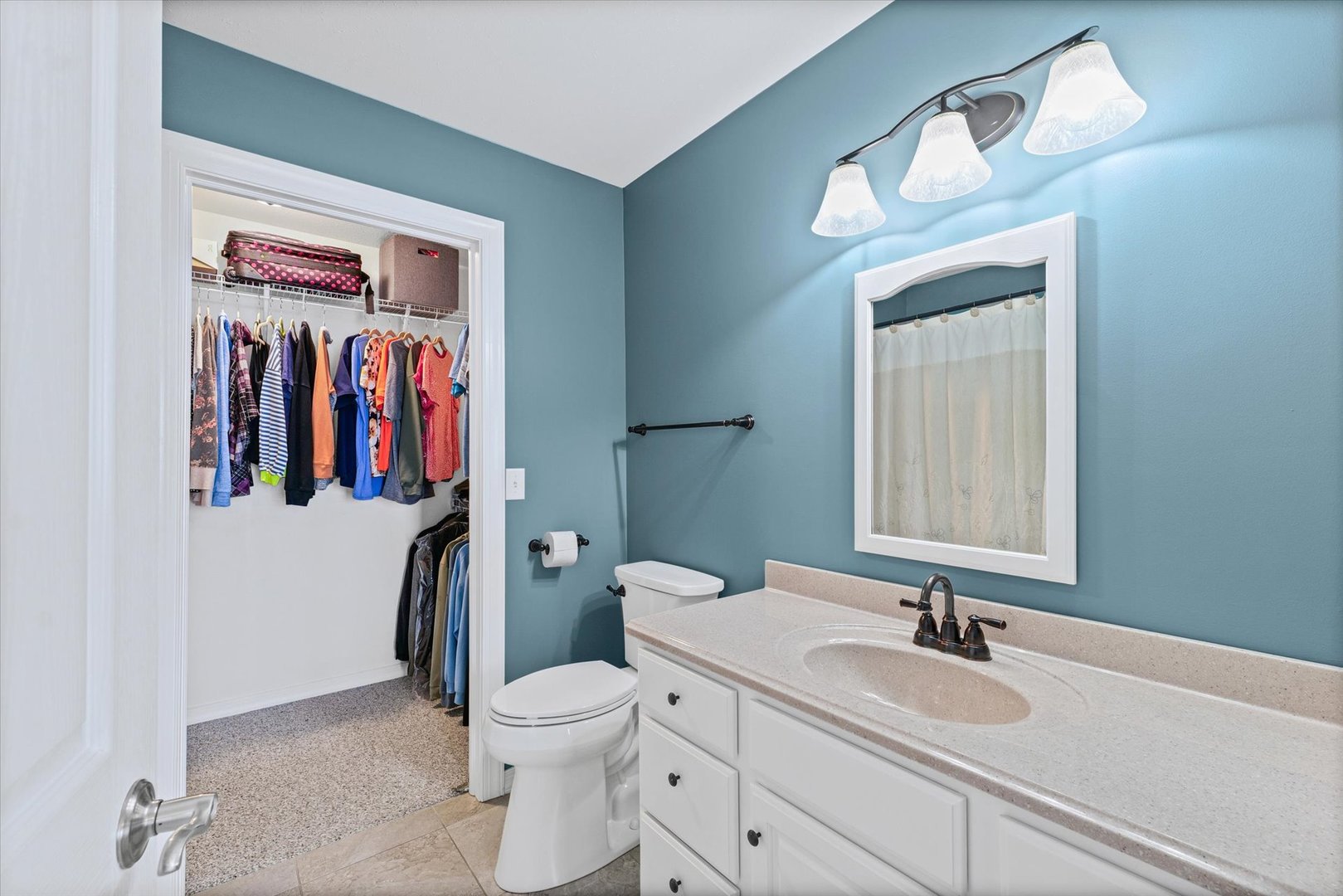 2523 Windward Boulevard, Unit 2523 Champaign, IL 61821 - Photo 15 of 26 a bathroom with a toilet sink and mirror