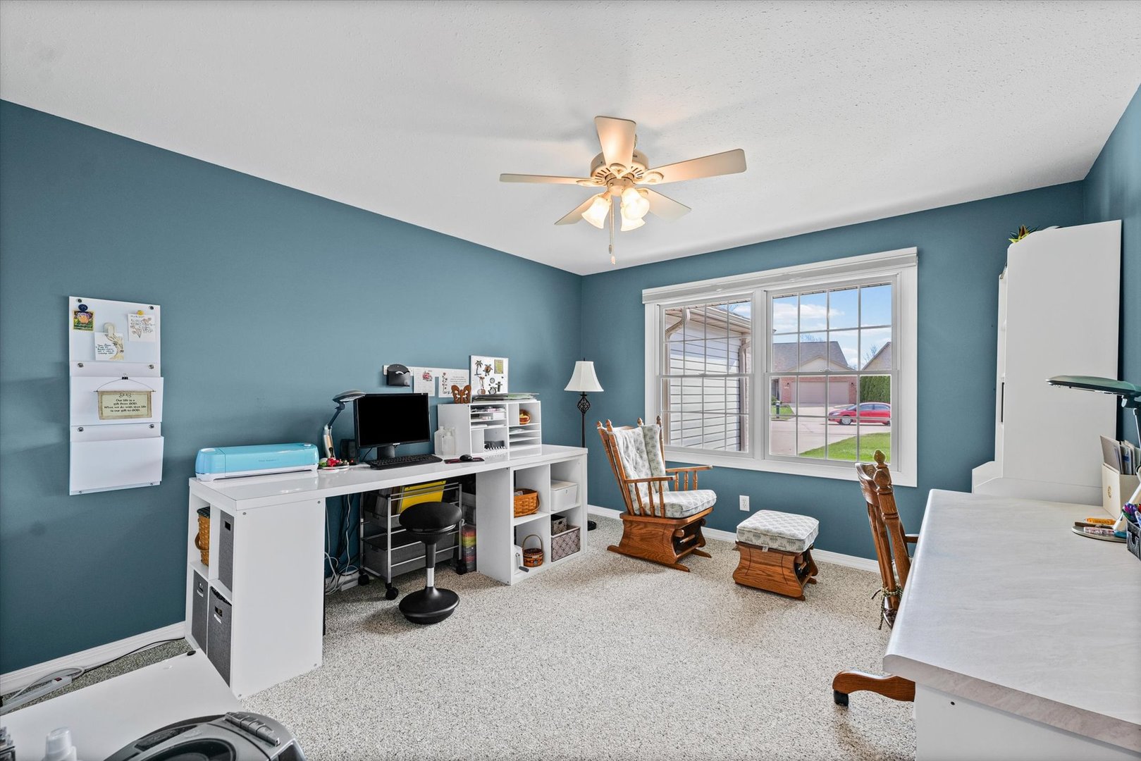 2523 Windward Boulevard, Unit 2523 Champaign, IL 61821 - Photo 16 of 26 a view of a workspace with furniture and a window
