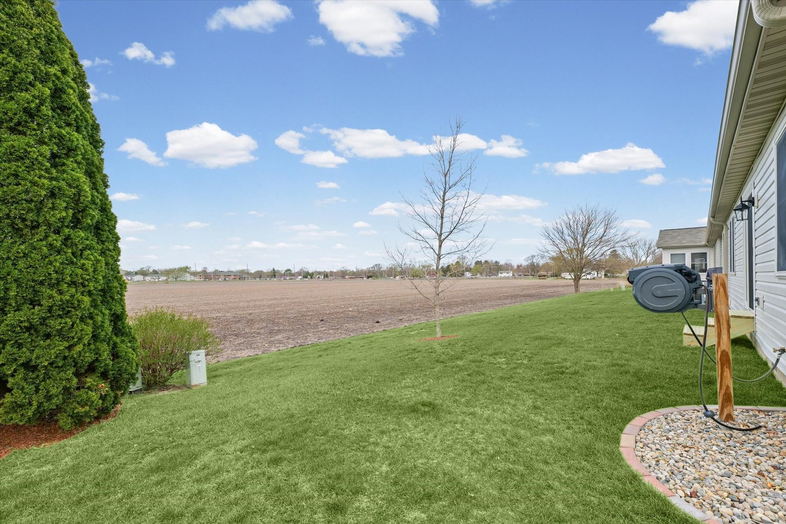 2523 Windward Boulevard, Unit 2523 Champaign, IL 61821 - Photo 23 of 26 a swimming pool with lots of green space