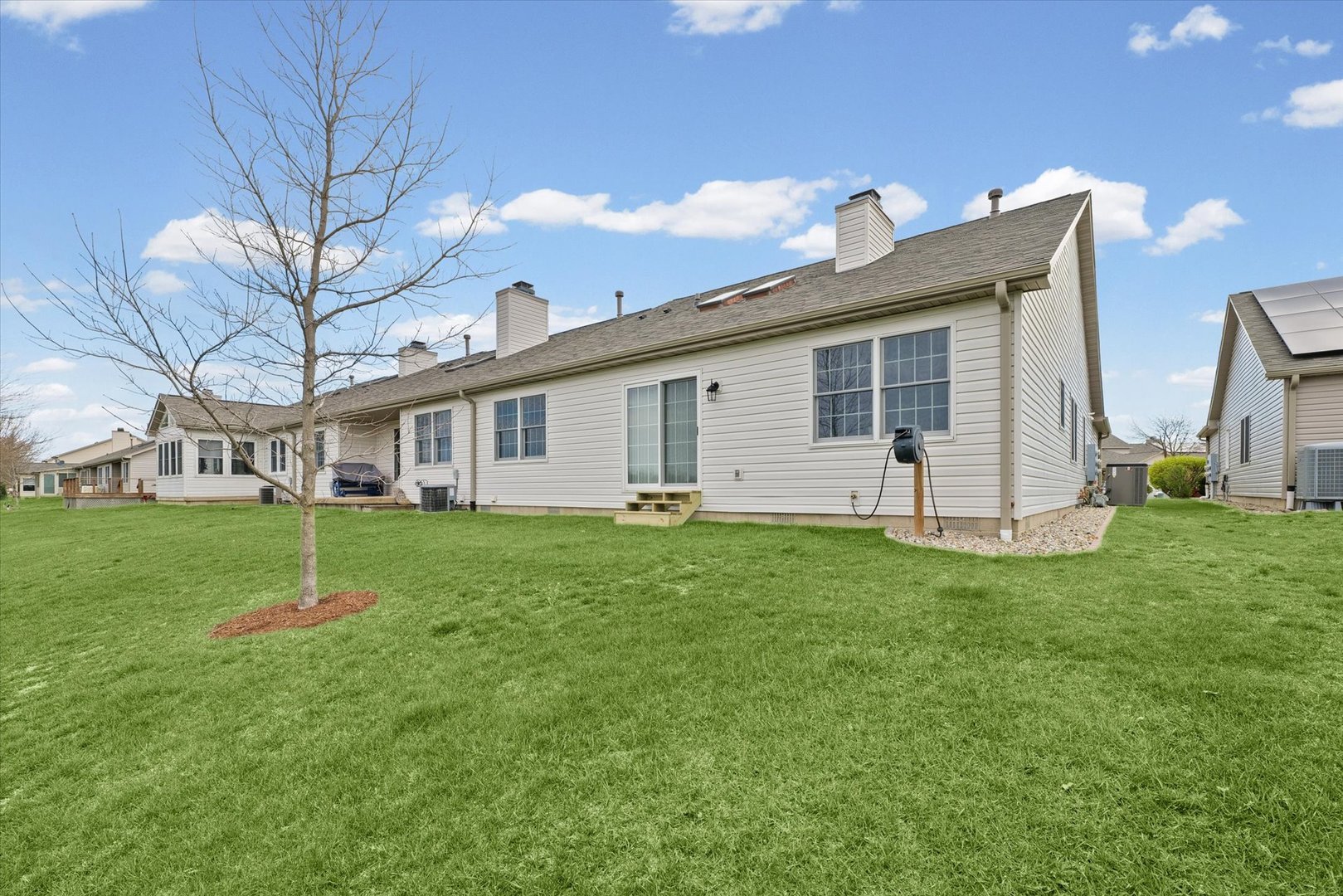 2523 Windward Boulevard, Unit 2523 Champaign, IL 61821 - Photo 24 of 26 a view of a house with backyard and porch