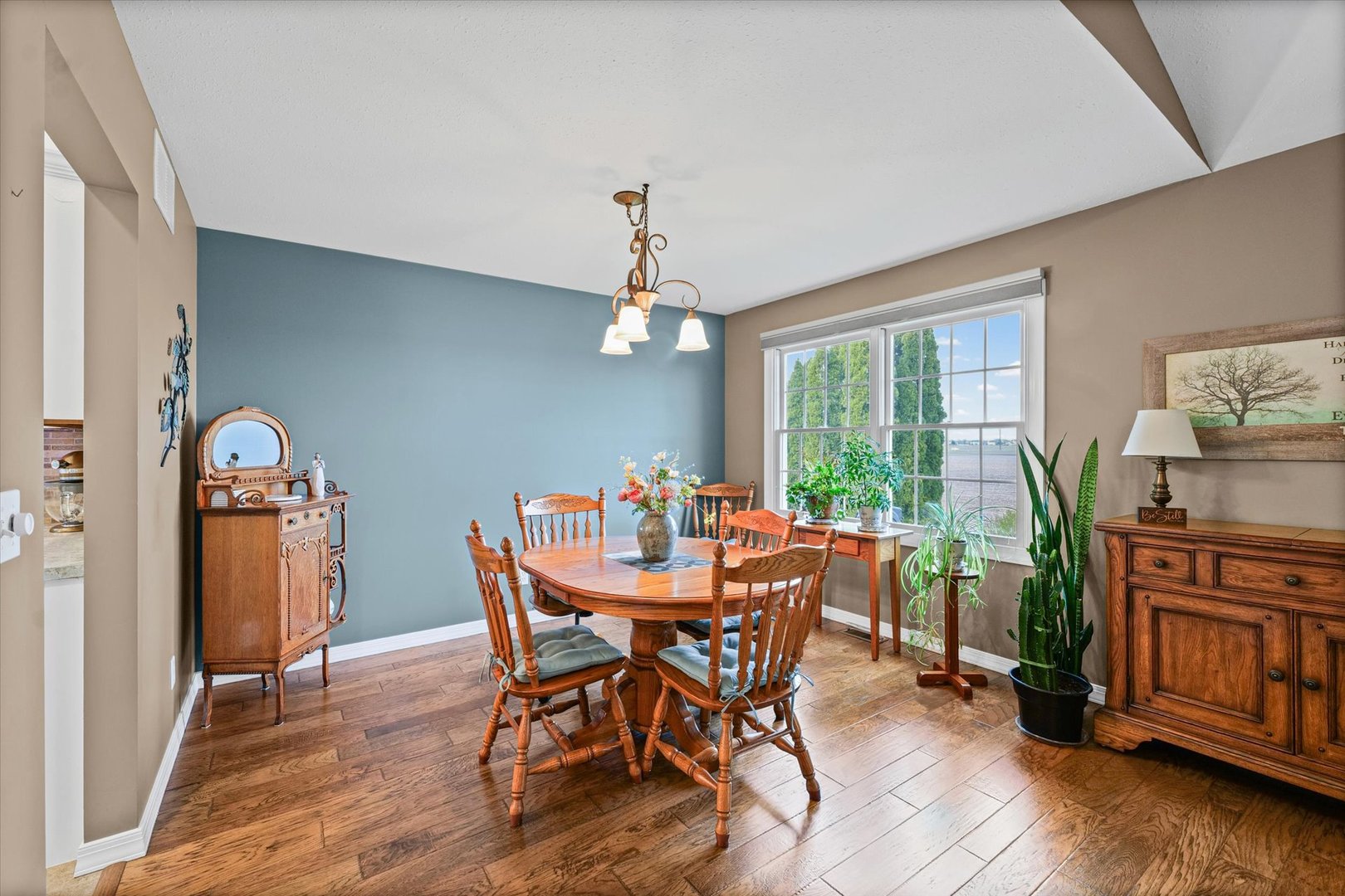 2523 Windward Boulevard, Unit 2523 Champaign, IL 61821 - Photo 7 of 26 a view of a dining room with furniture window and wooden floor