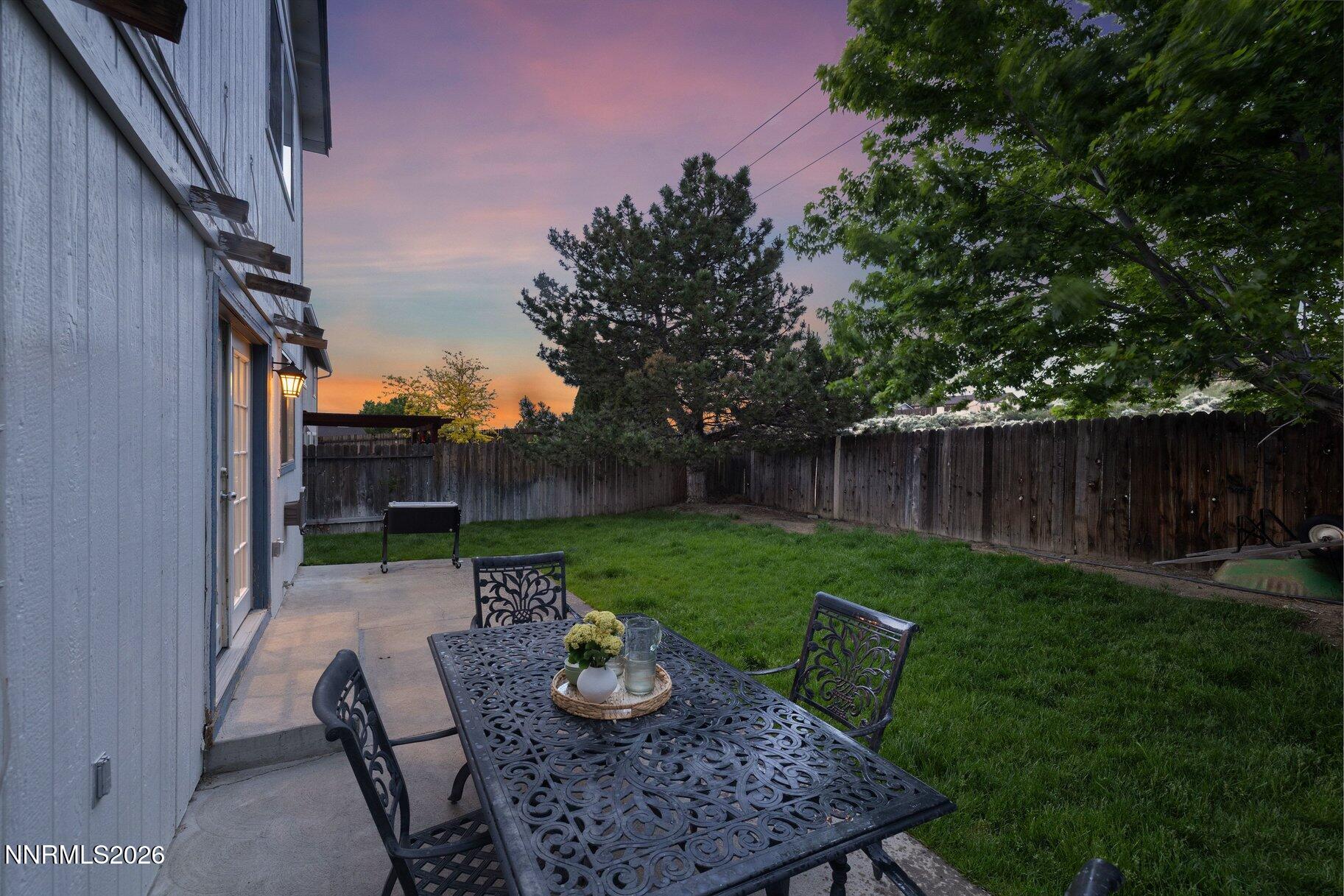 8486 Piper Place Reno, NV 89506 - Photo 11 of 80 a view of backyard with seating space and trees