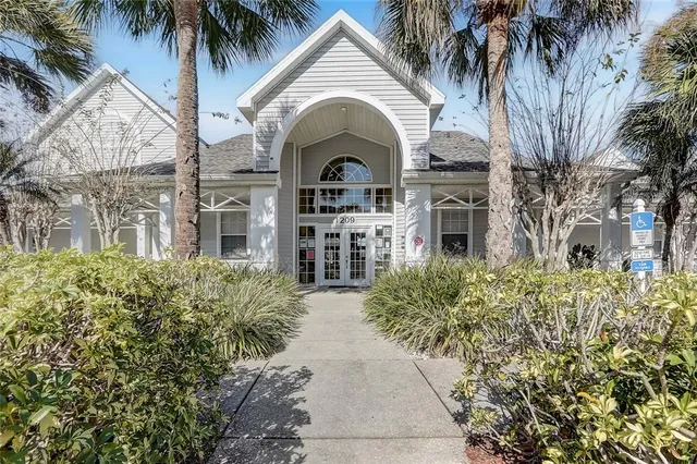 a living room with furniture a fireplace and a table
