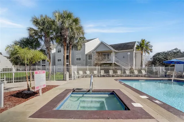 a view of a lake with houses in the back