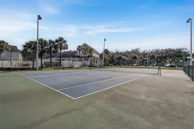a view of a garden with lawn chairs