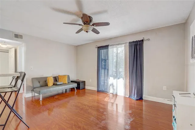 a living room with furniture and a window