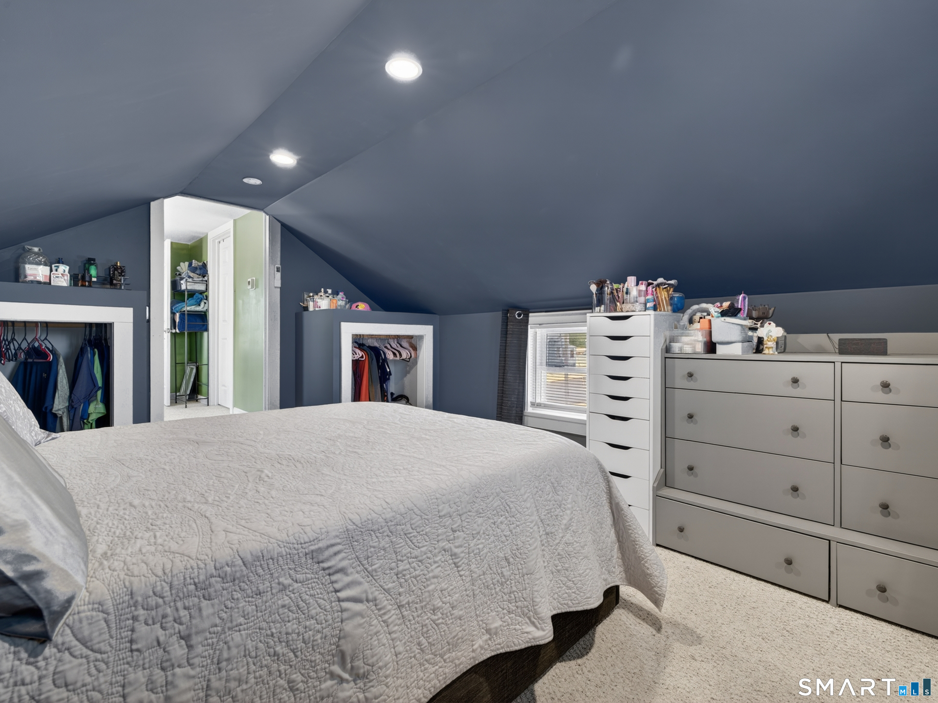 13 Oak Street Groton, CT 06340 - Photo 21 of 38 a bedroom with a bed and a mirror
