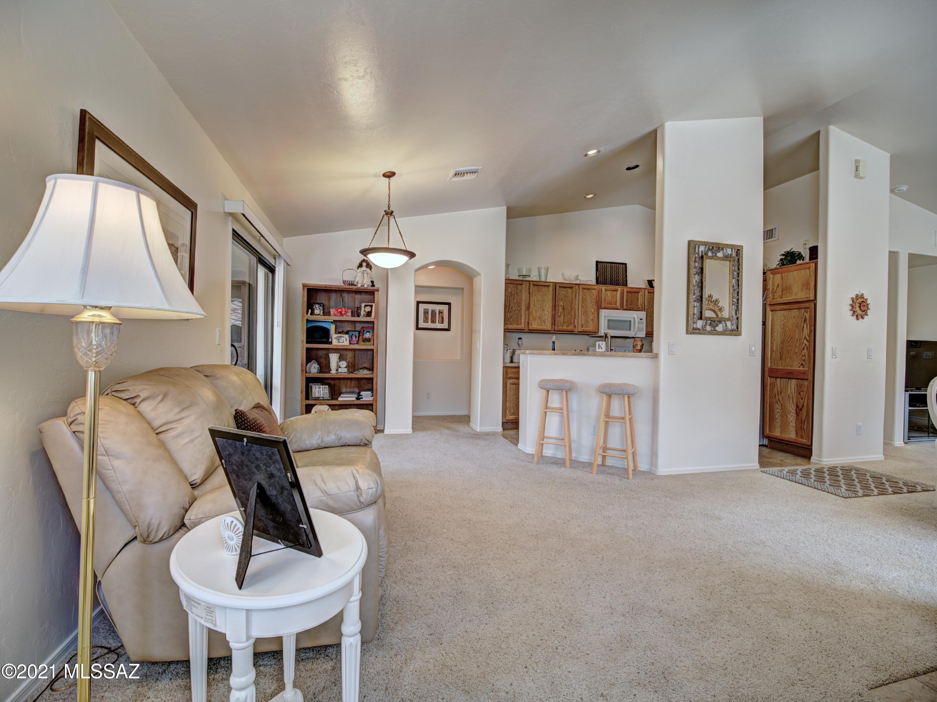 434 Colorado Court Rio Rico, AZ 85648 - Photo 5 of 29 a living room with furniture and a kitchen