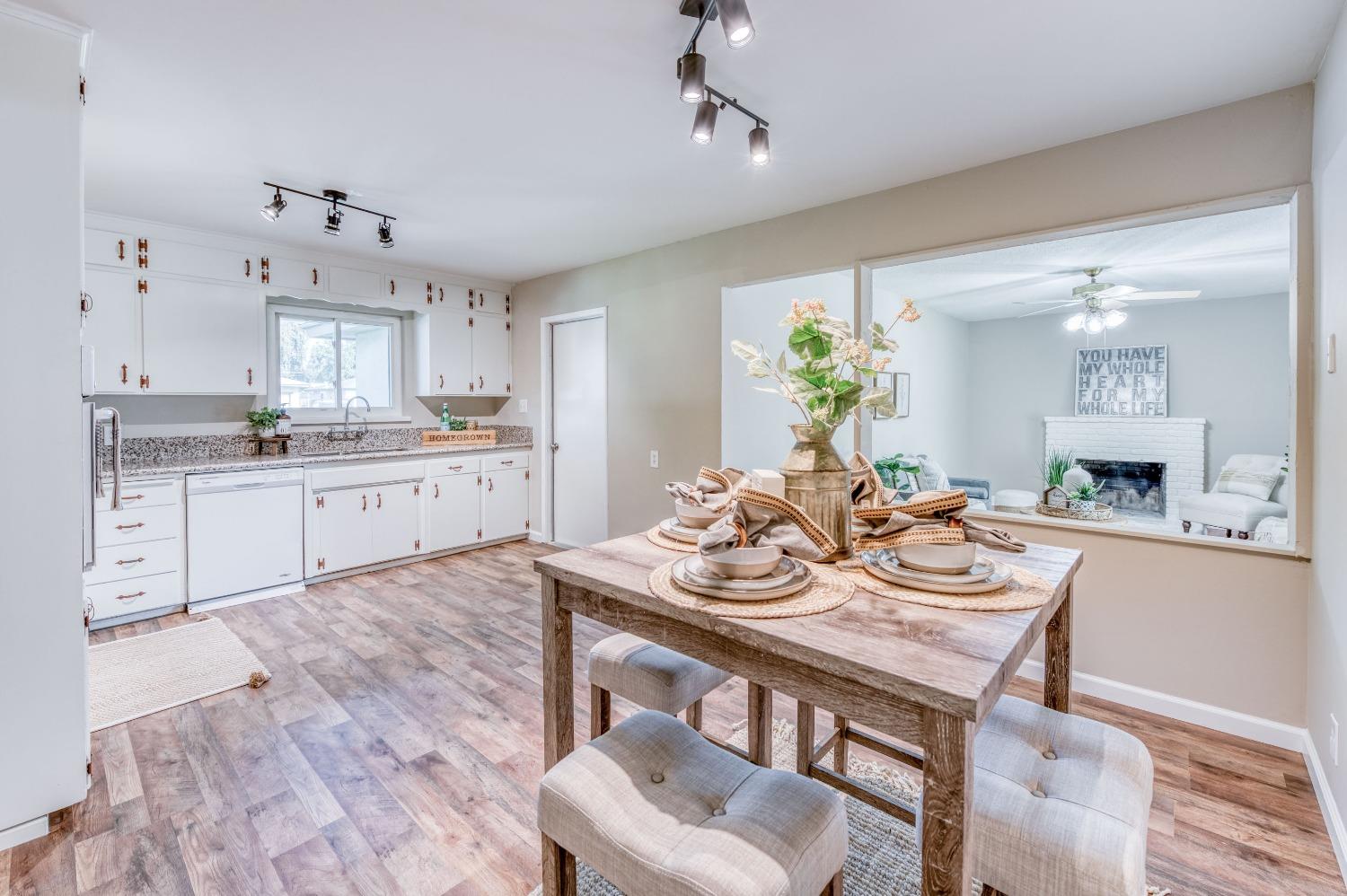 638 West Dennis Drive Clovis, CA 93612 - Photo 12 of 33 a view of kitchen with cabinets dining table and chairs