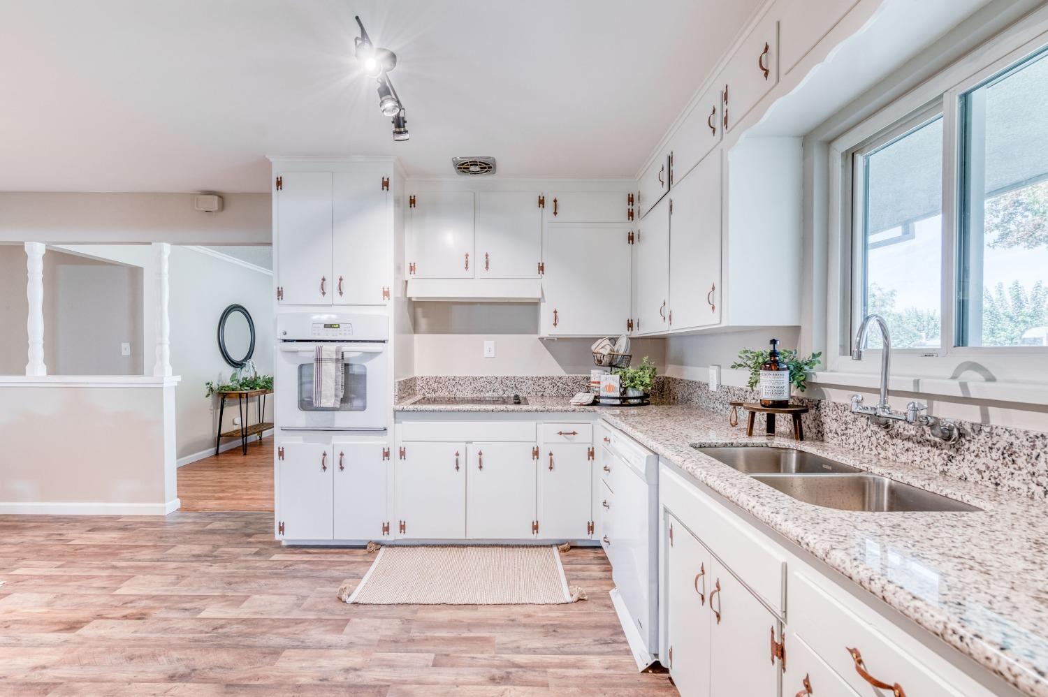 638 West Dennis Drive Clovis, CA 93612 - Photo 15 of 33 a kitchen with granite countertop a sink stainless steel appliances and cabinets