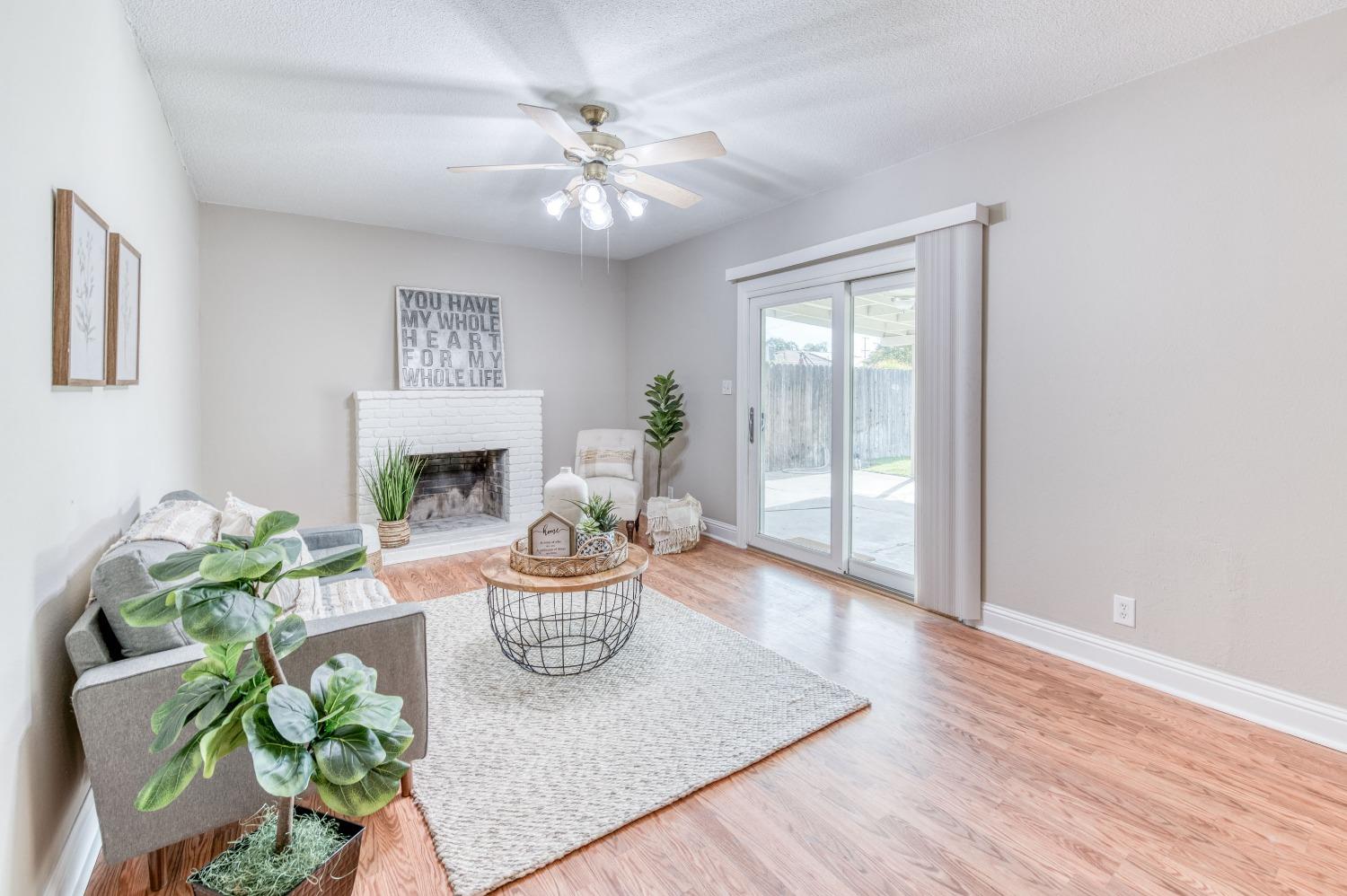 638 West Dennis Drive Clovis, CA 93612 - Photo 16 of 33 a living room with furniture and a fireplace