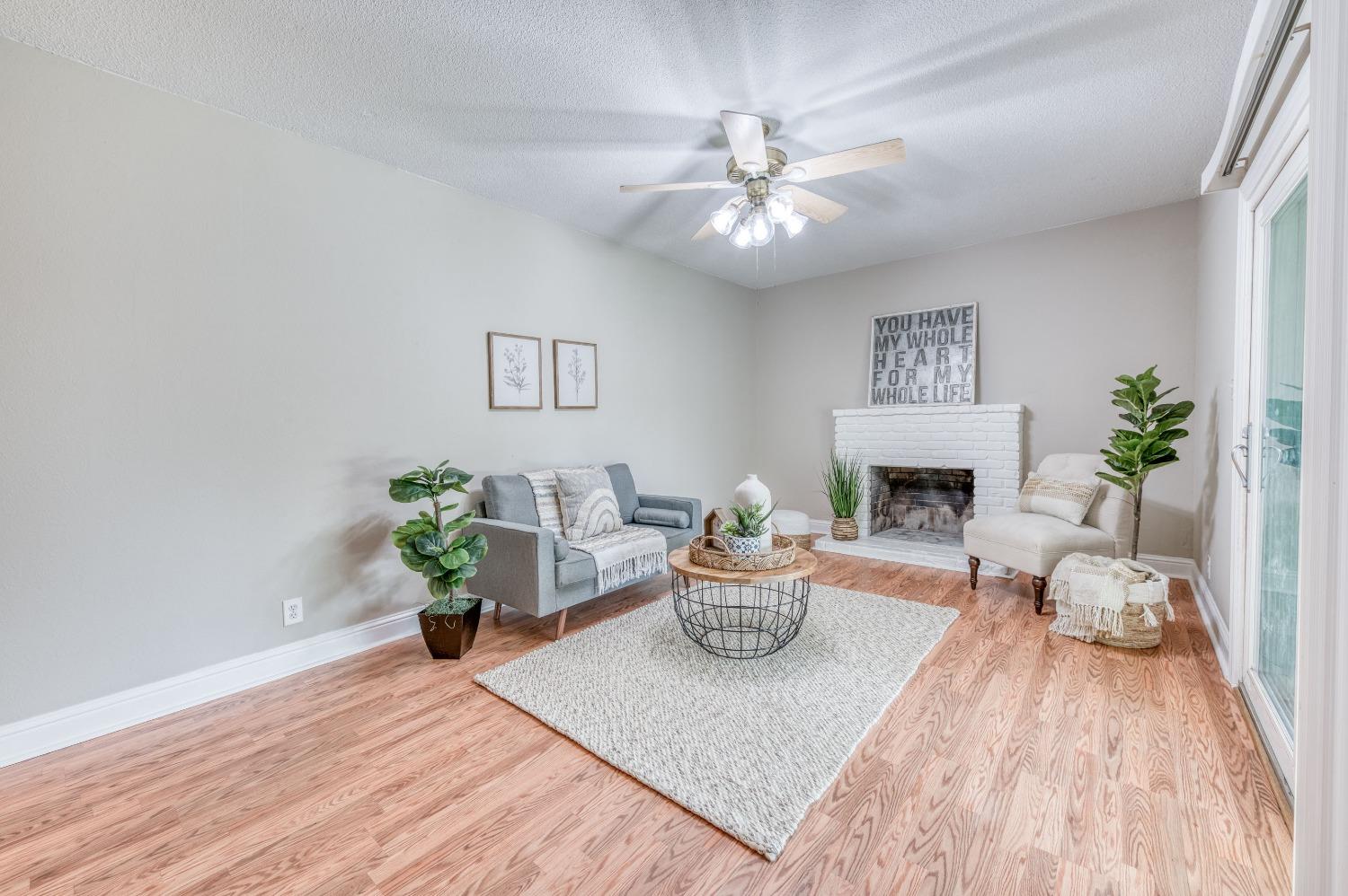 638 West Dennis Drive Clovis, CA 93612 - Photo 17 of 33 a living room with furniture and a fireplace