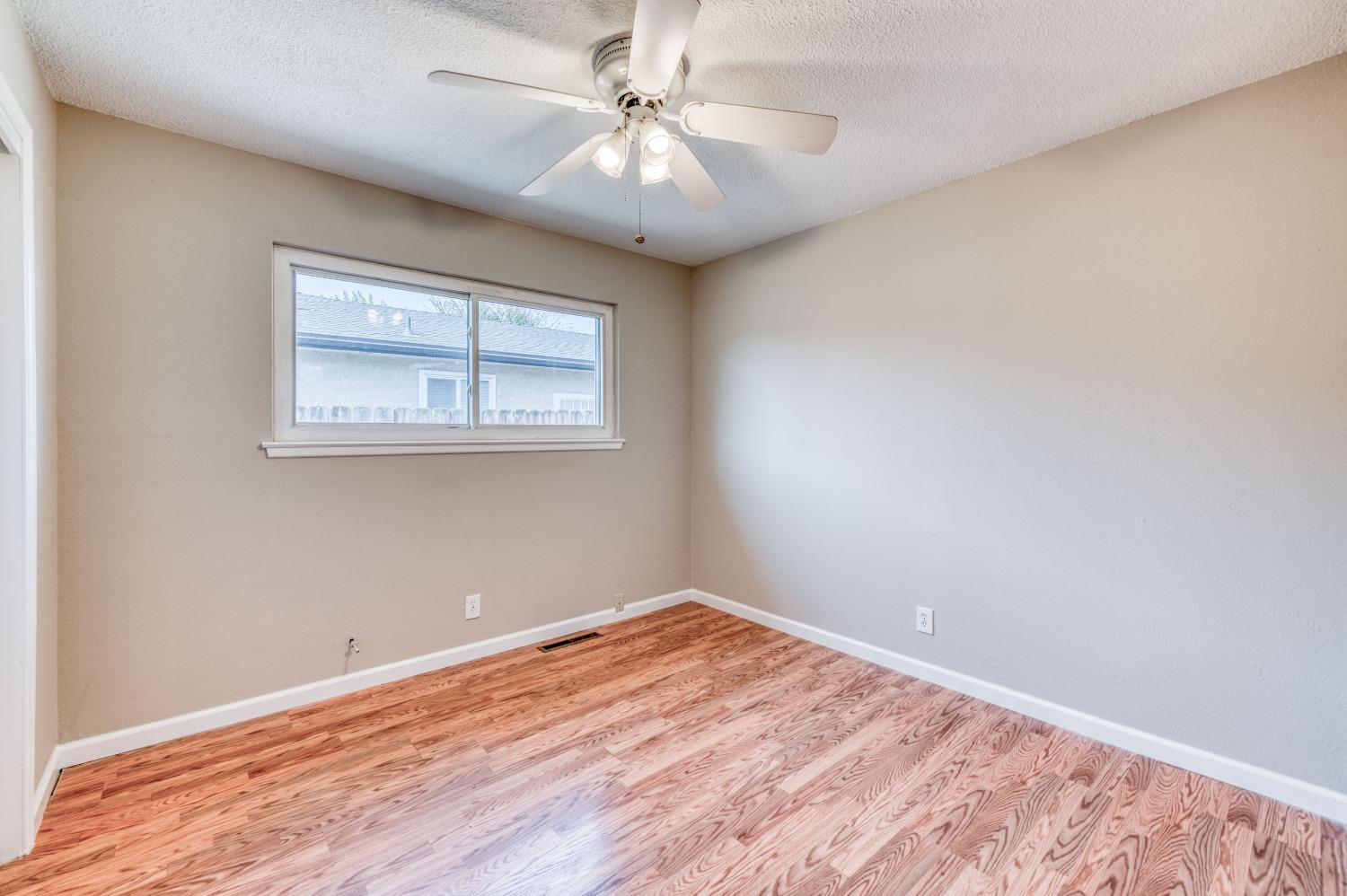 638 West Dennis Drive Clovis, CA 93612 - Photo 20 of 33 wooden floor in an empty room with a window