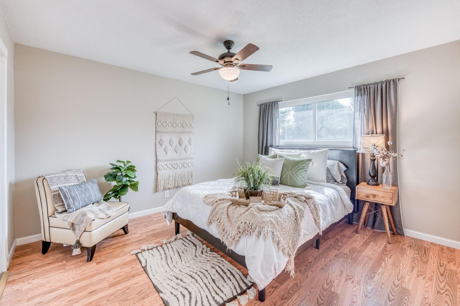 638 West Dennis Drive Clovis, CA 93612 - Photo 22 of 33 a bedroom with a bed and a table