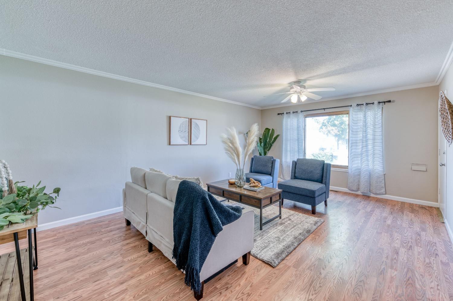 638 West Dennis Drive Clovis, CA 93612 - Photo 8 of 33 a living room with furniture and a wooden floor