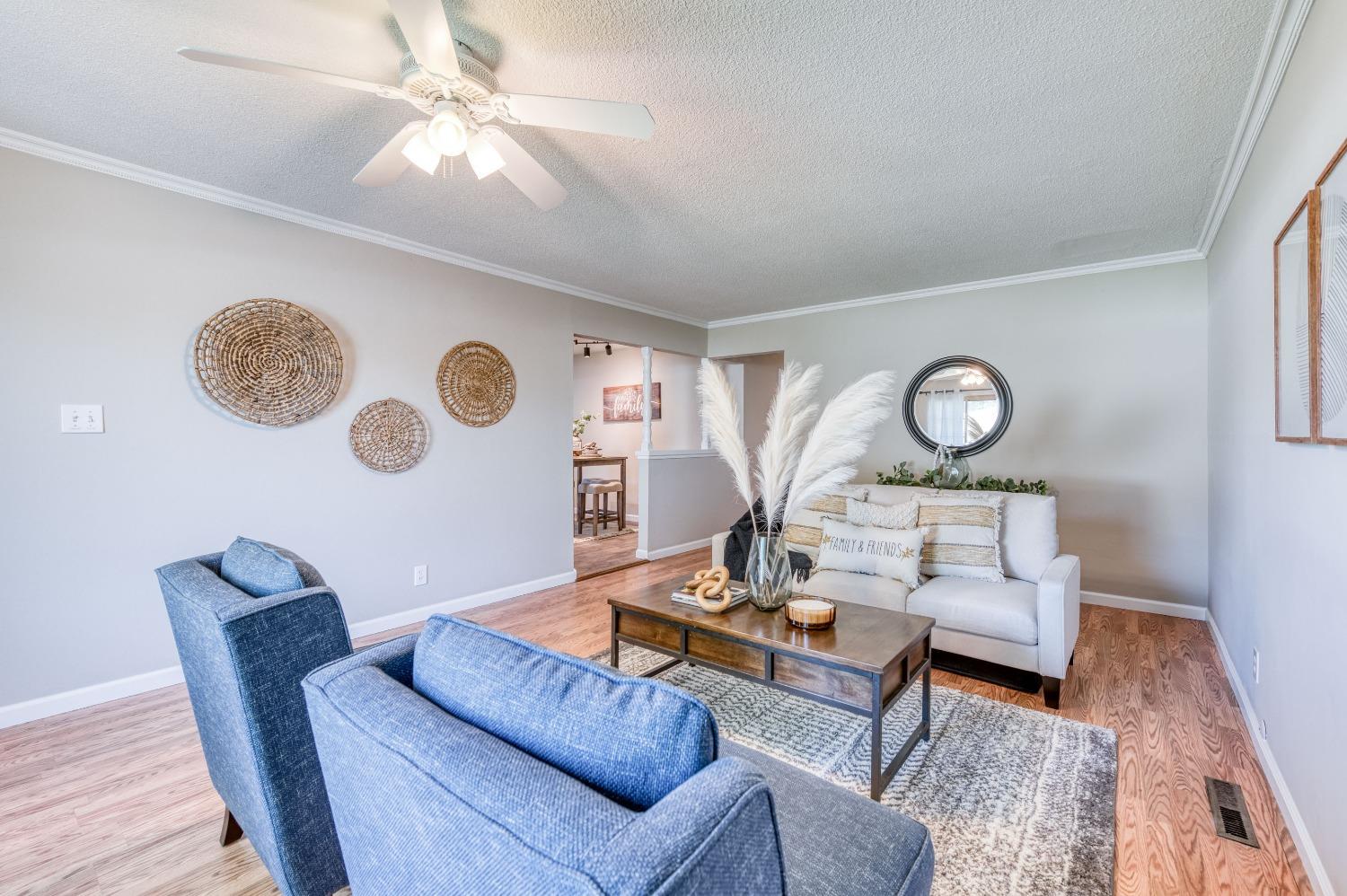 638 West Dennis Drive Clovis, CA 93612 - Photo 10 of 33 a living room with furniture and a wooden floor