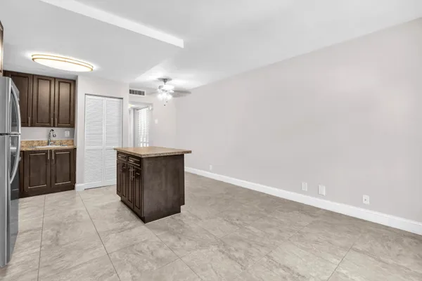 a kitchen with granite countertop a cabinets and steel stainless steel appliances