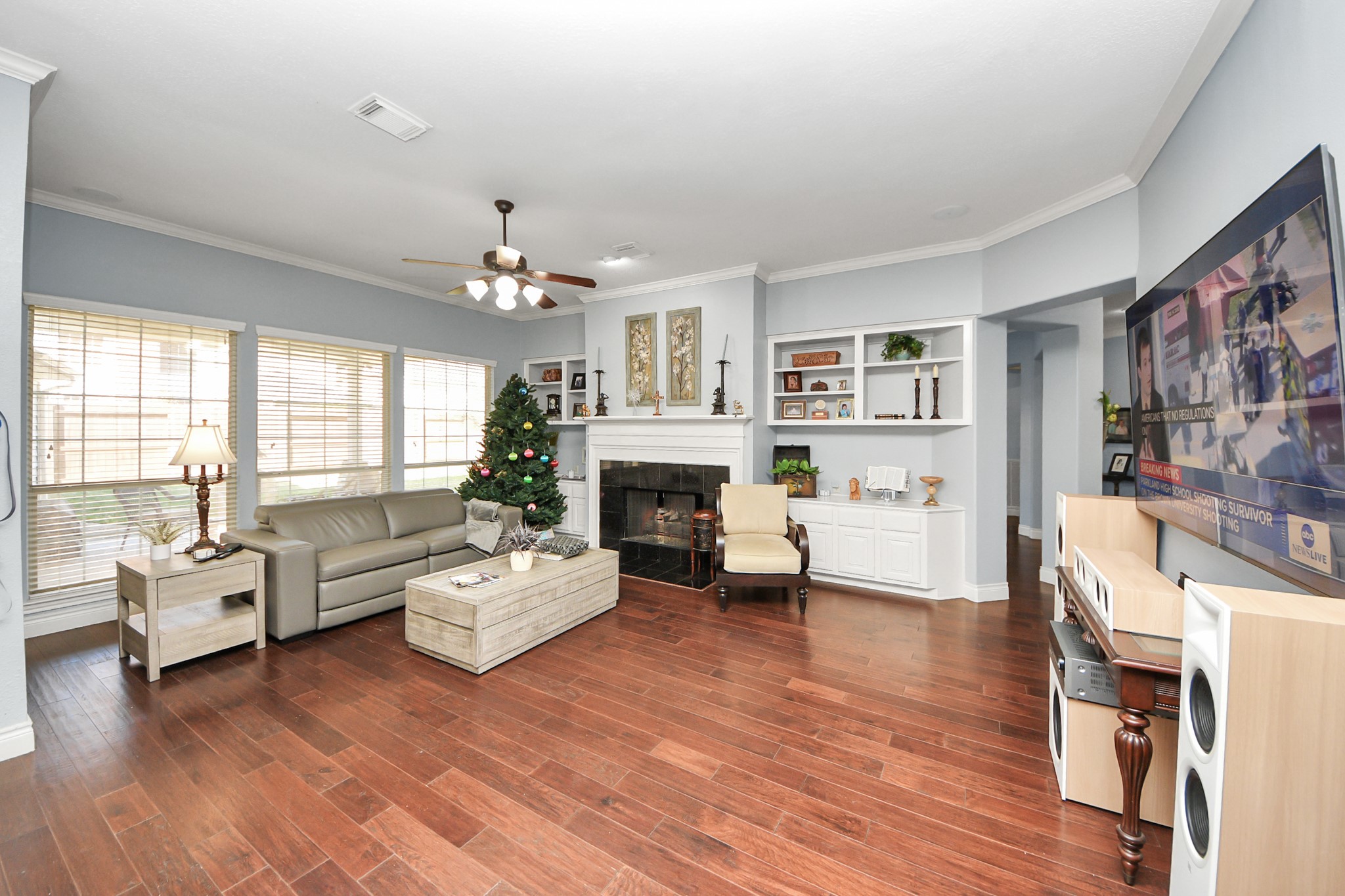 22010 Castlewind Court Katy, TX 77450 - Photo 11 of 41 a living room with furniture large window and wooden floor