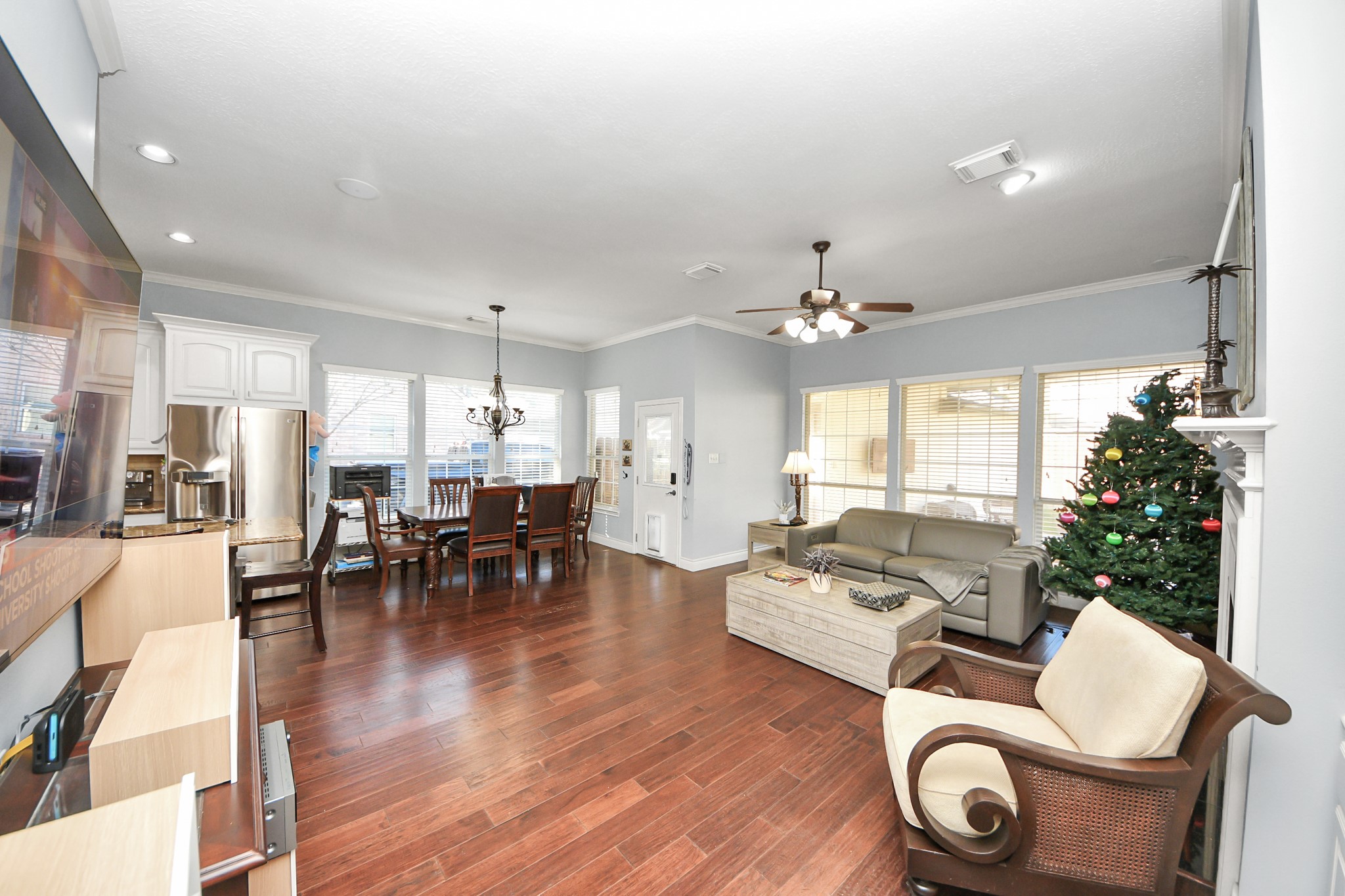 22010 Castlewind Court Katy, TX 77450 - Photo 12 of 41 a living room with furniture and wooden floor