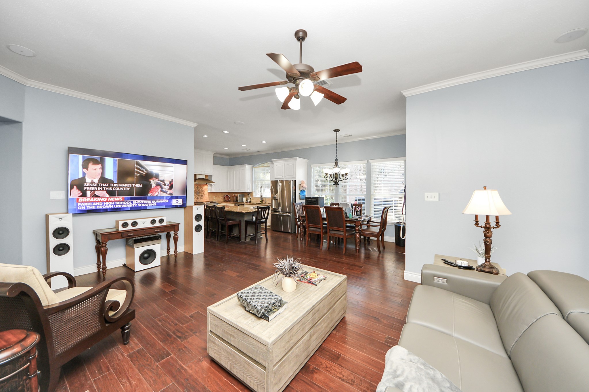 22010 Castlewind Court Katy, TX 77450 - Photo 13 of 41 a living room with furniture kitchen view and a chandelier