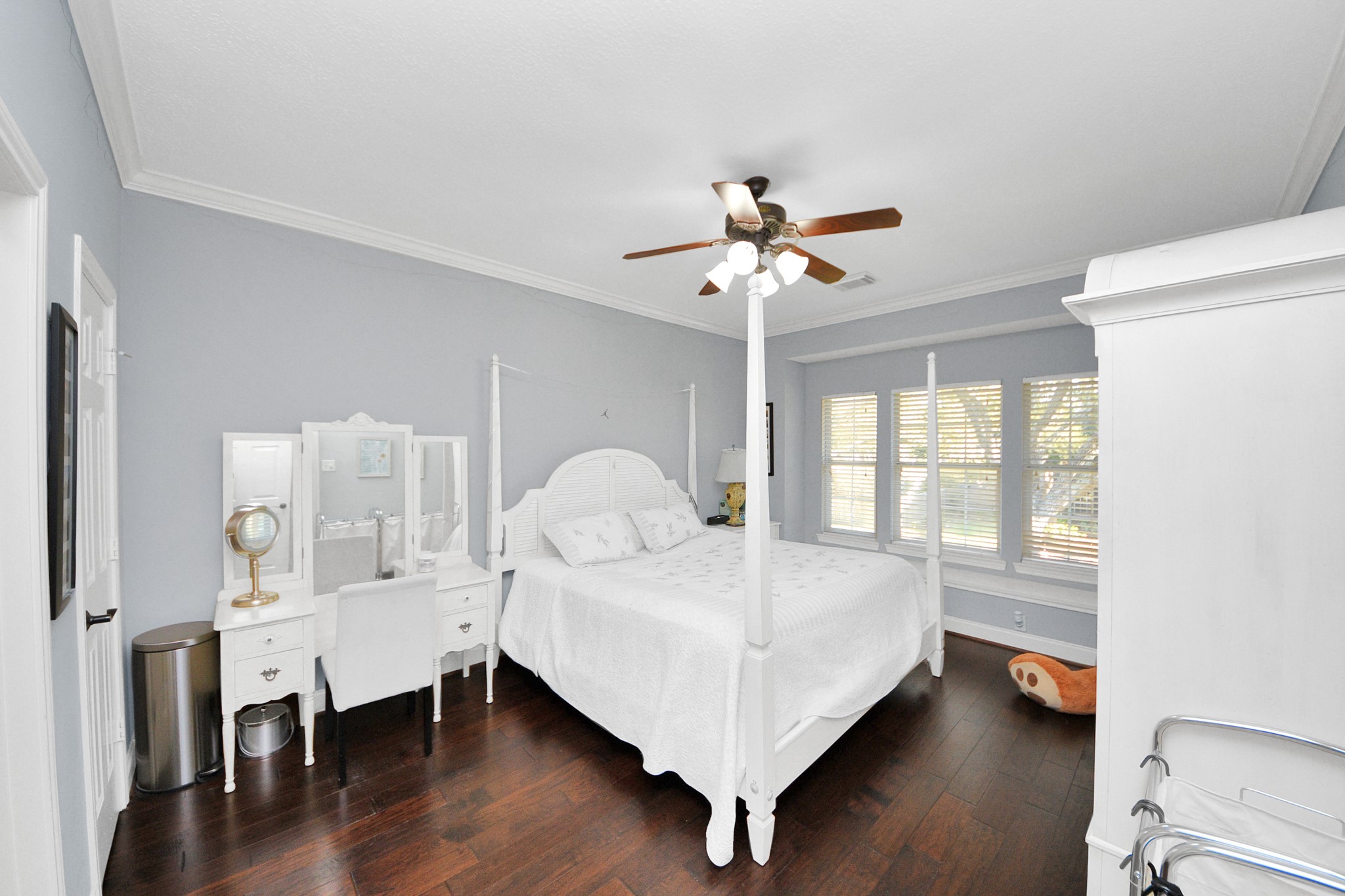 22010 Castlewind Court Katy, TX 77450 - Photo 35 of 41 a bed sitting in a bedroom next to a window