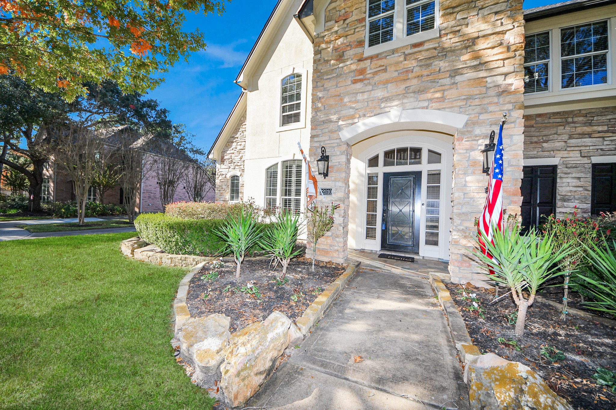 22010 Castlewind Court Katy, TX 77450 - Photo 4 of 41 a front view of a house with garden