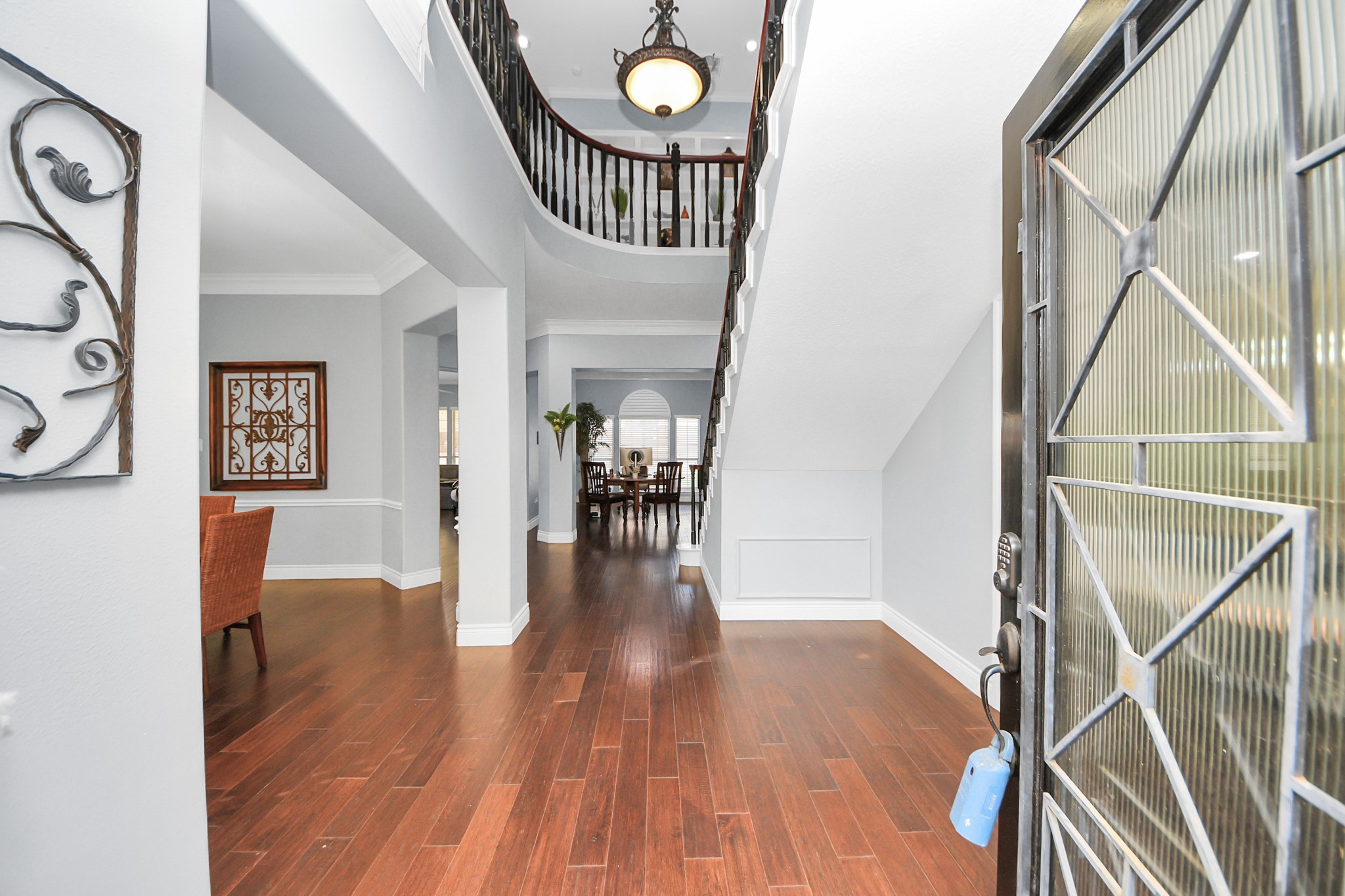 22010 Castlewind Court Katy, TX 77450 - Photo 5 of 41 a view of entryway with wooden floor