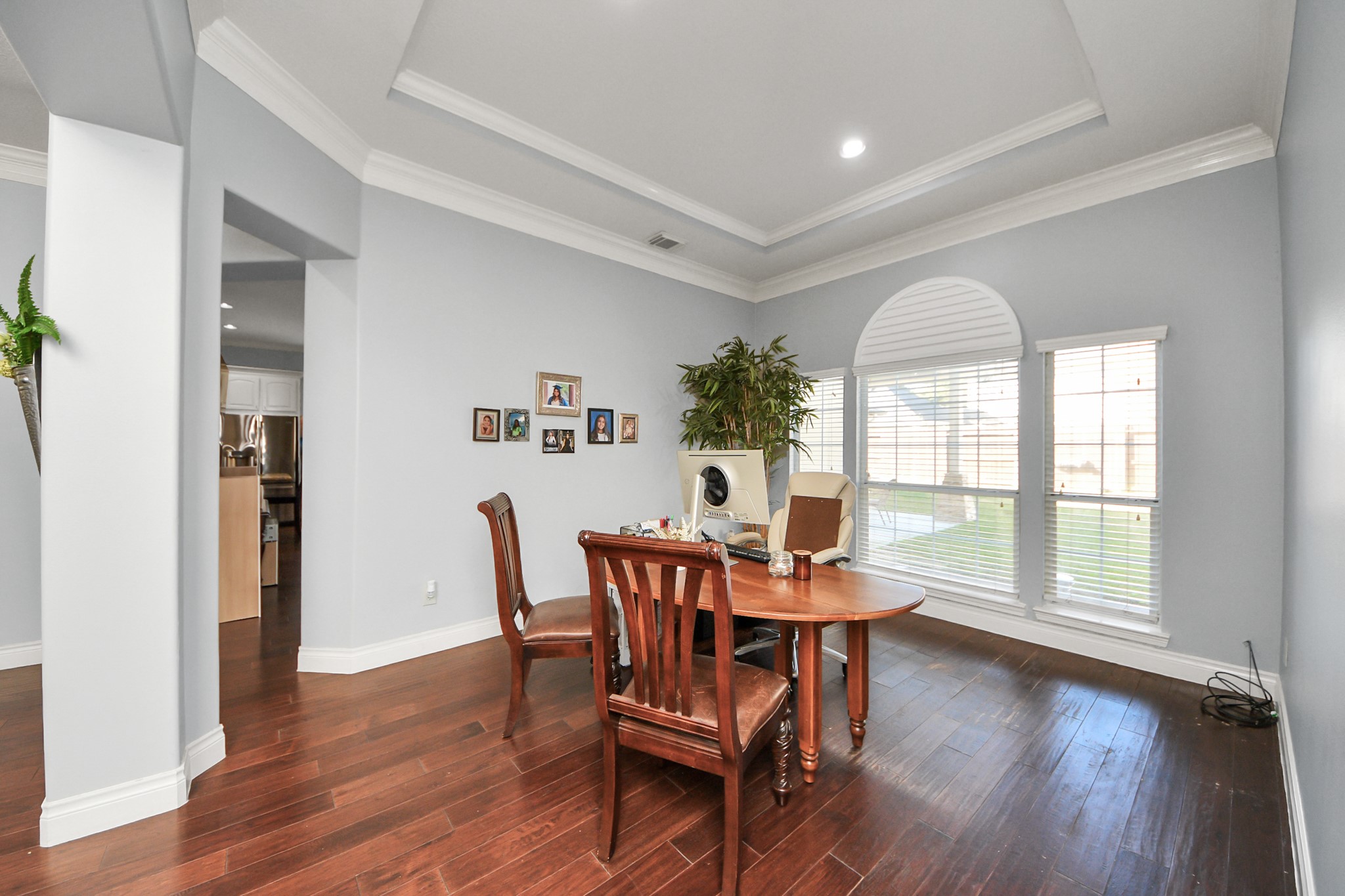 22010 Castlewind Court Katy, TX 77450 - Photo 9 of 41 a view of a dining room with furniture and wooden floor