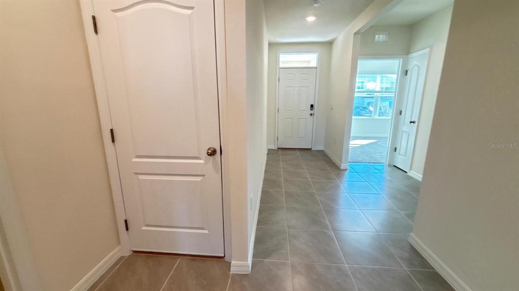 914 Princess Sabal Point Haines City, FL 33844 - Photo 14 of 39 wooden floor with white walls