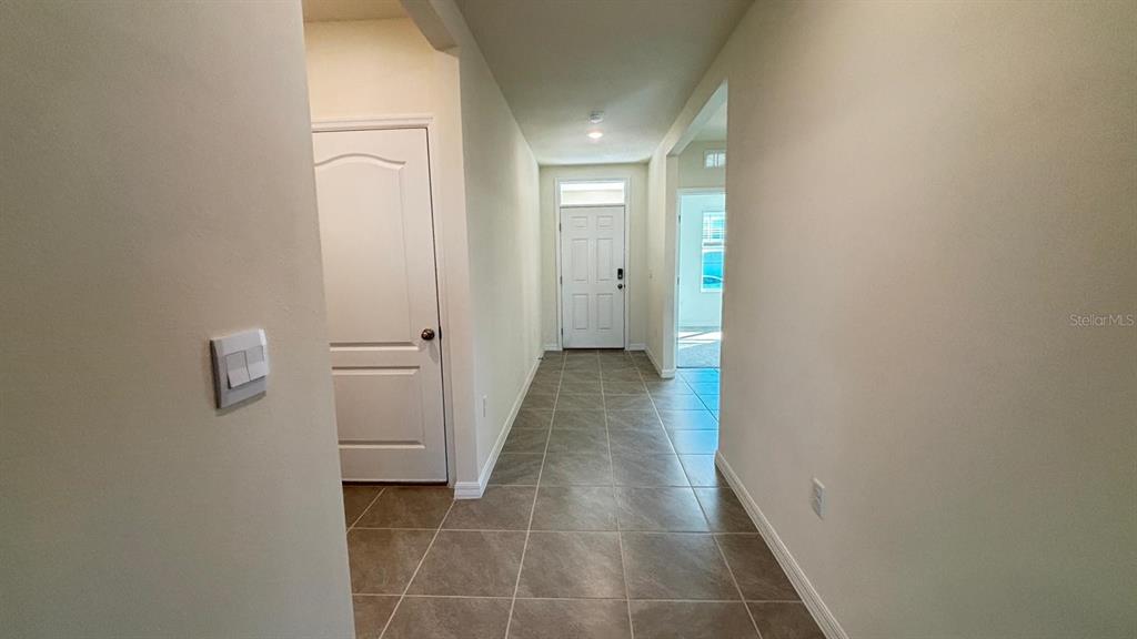 914 Princess Sabal Point Haines City, FL 33844 - Photo 15 of 39 a view of a hallway with wooden floor
