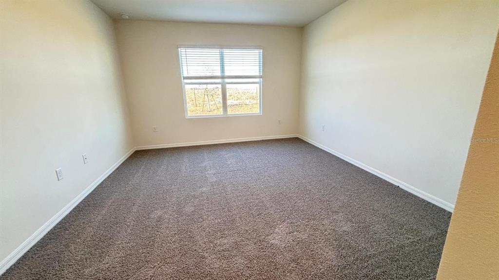 914 Princess Sabal Point Haines City, FL 33844 - Photo 19 of 39 an empty room with a window