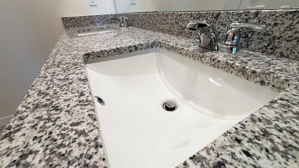 914 Princess Sabal Point Haines City, FL 33844 - Photo 22 of 39 a close view of a sink a mirror and shower in a bathroom