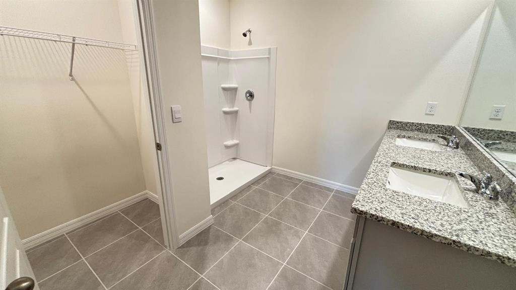 914 Princess Sabal Point Haines City, FL 33844 - Photo 24 of 39 a bathroom with a sink and shower