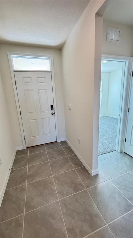 914 Princess Sabal Point Haines City, FL 33844 - Photo 31 of 39 a view of an empty room with closet and utility room