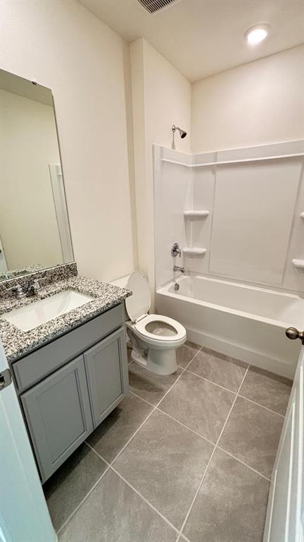 914 Princess Sabal Point Haines City, FL 33844 - Photo 32 of 39 a bathroom with a granite countertop sink toilet and shower