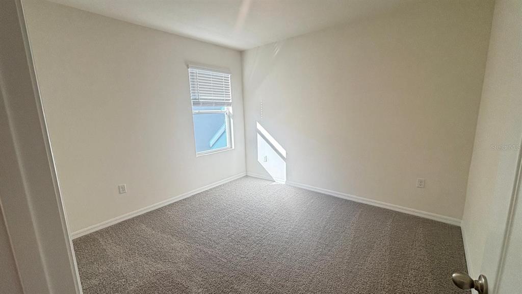 914 Princess Sabal Point Haines City, FL 33844 - Photo 33 of 39 a view of an empty room and a window