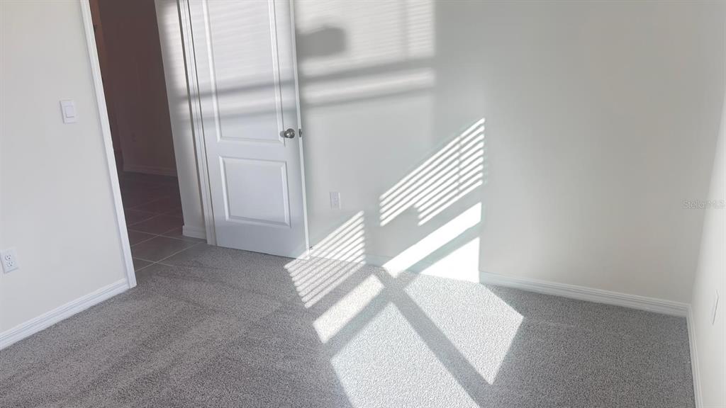 914 Princess Sabal Point Haines City, FL 33844 - Photo 35 of 39 a view of staircase with white walls and a window