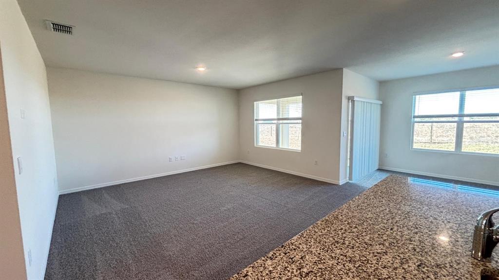 914 Princess Sabal Point Haines City, FL 33844 - Photo 4 of 39 an empty room with windows