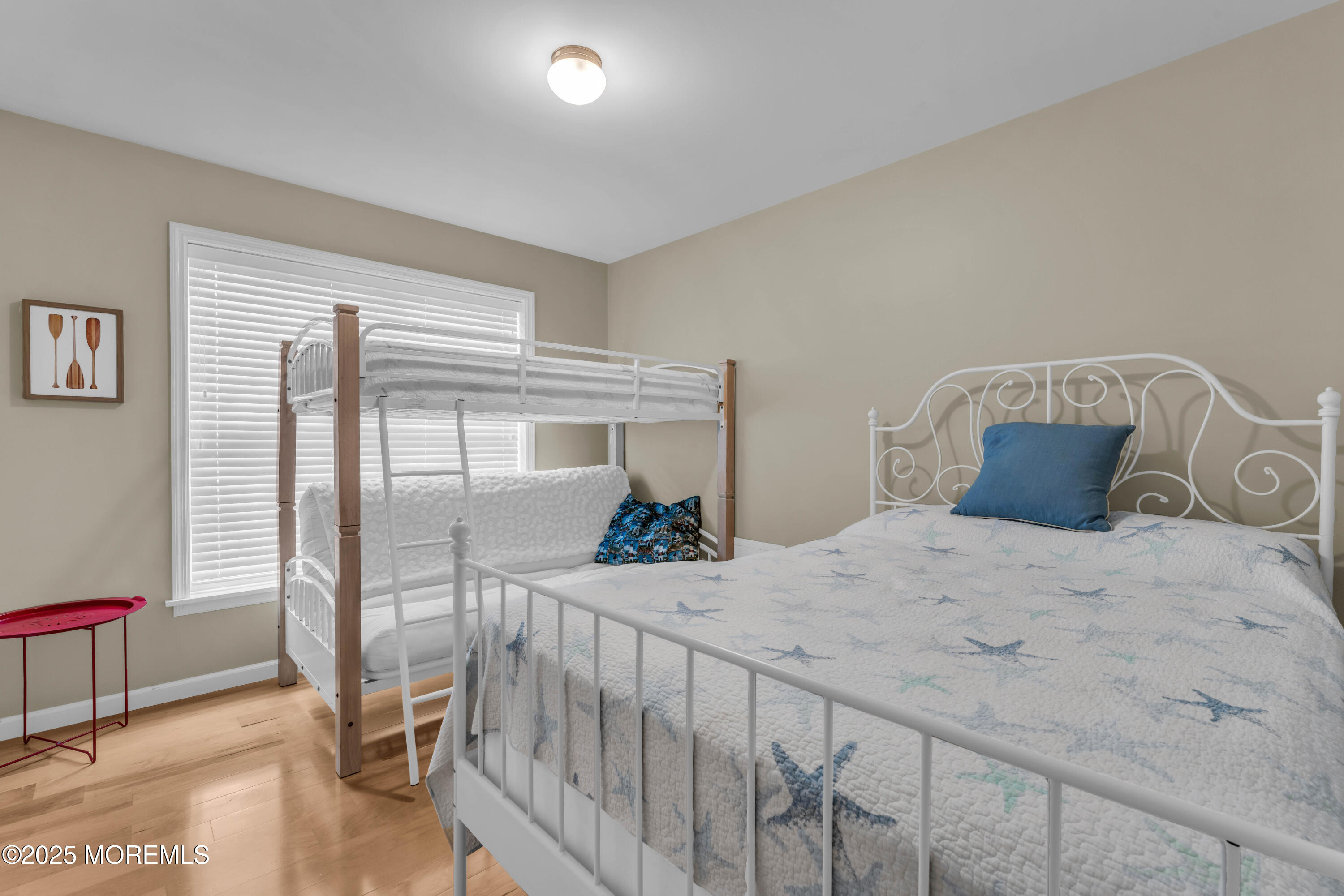 111 7th Avenue Seaside Park, NJ 08752 - Photo 17 of 46 a bedroom with a bed and a large window