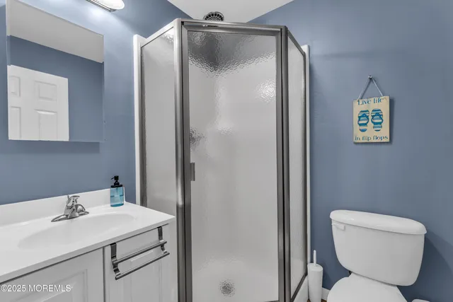 a spacious bedroom with a bed and dresser