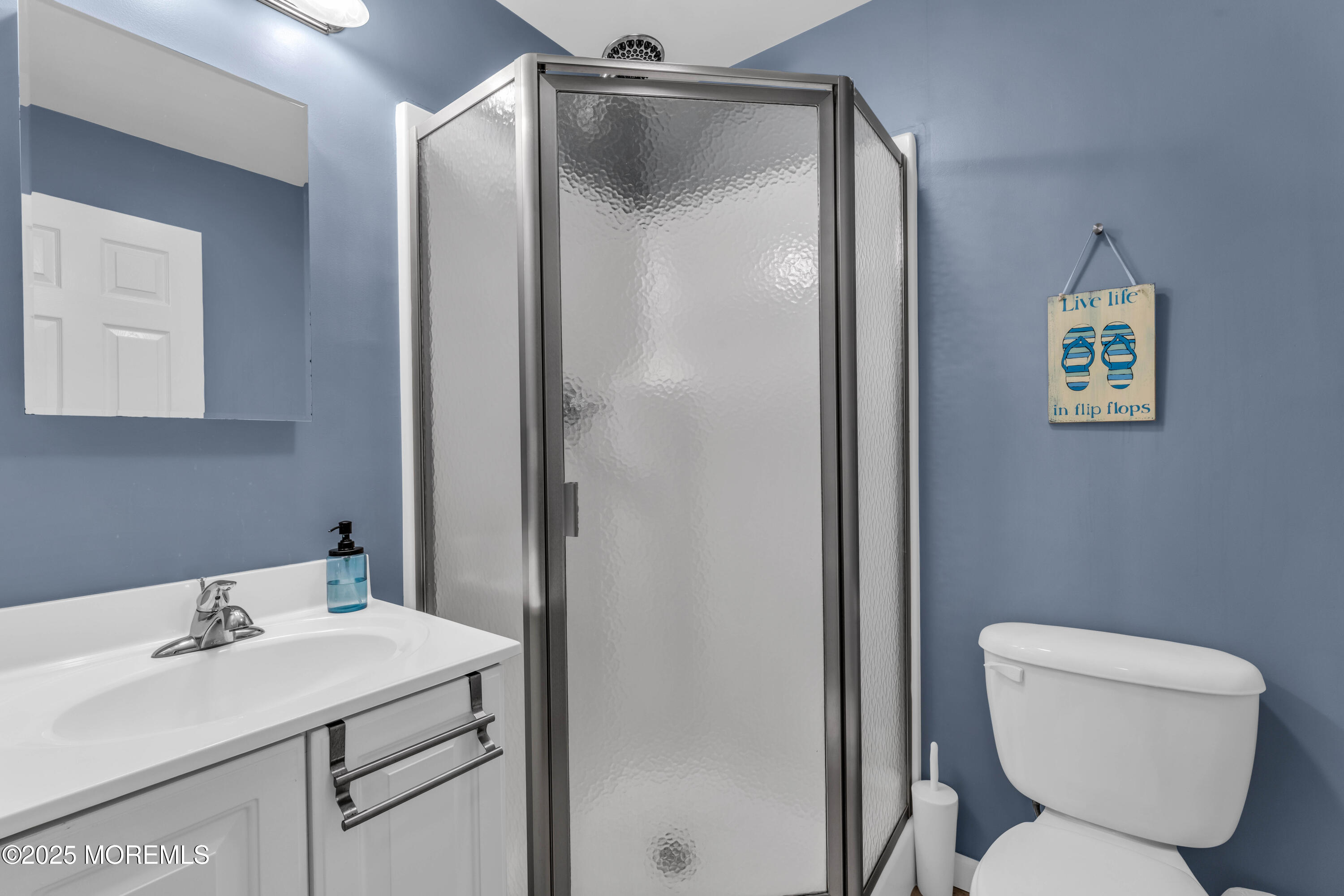 111 7th Avenue Seaside Park, NJ 08752 - Photo 18 of 46 a bathroom with a toilet sink and shower