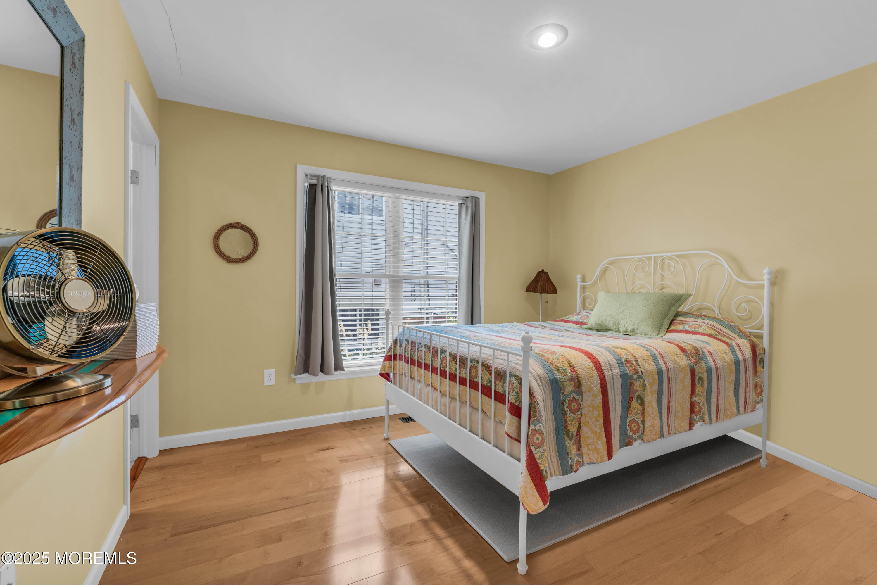 111 7th Avenue Seaside Park, NJ 08752 - Photo 19 of 46 a spacious bedroom with a bed and dresser