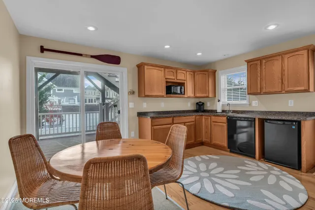 a kitchen with stainless steel appliances granite countertop a stove microwave and sink