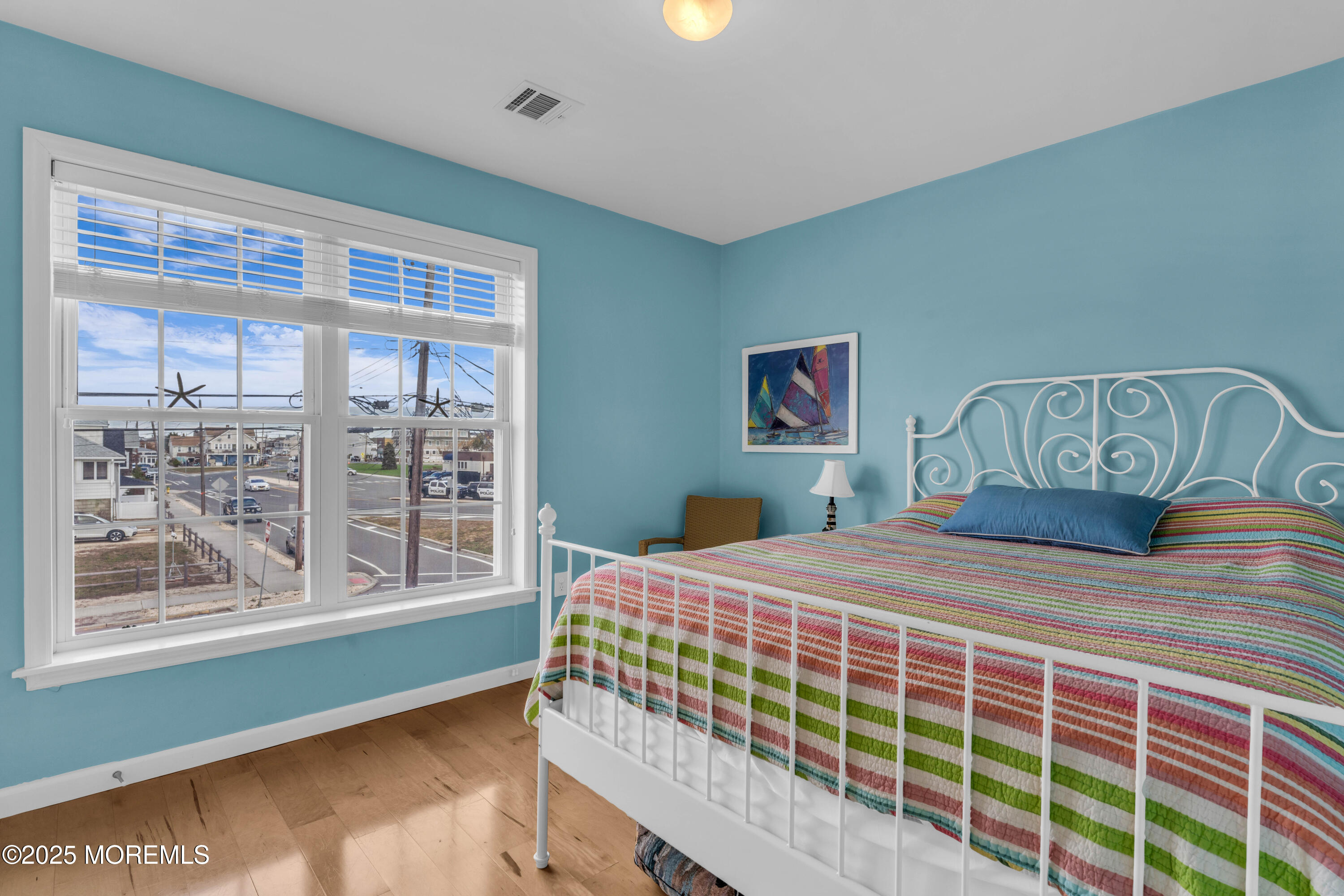 111 7th Avenue Seaside Park, NJ 08752 - Photo 29 of 46 a bedroom with a large bed and a window