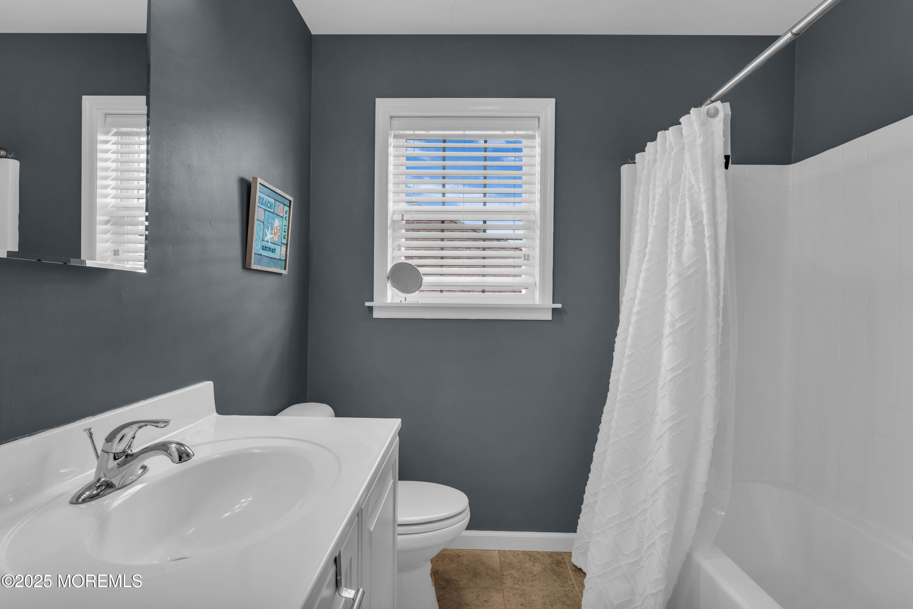 111 7th Avenue Seaside Park, NJ 08752 - Photo 30 of 46 a bathroom with a sink toilet and mirror