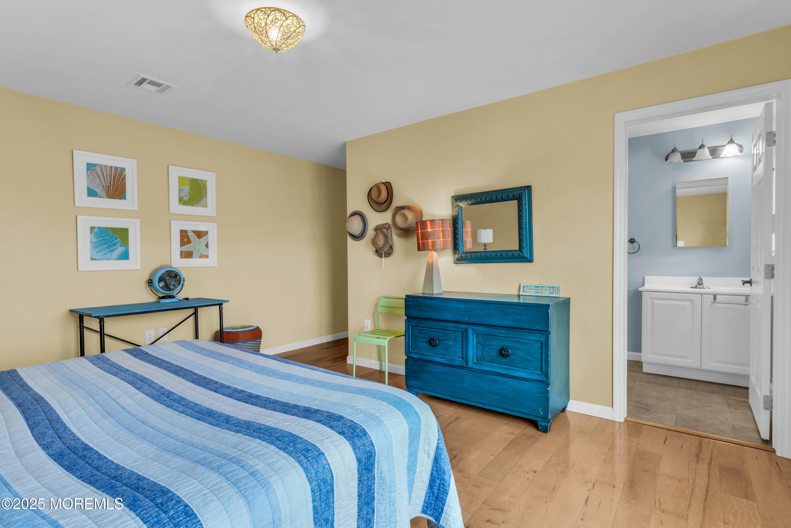 111 7th Avenue Seaside Park, NJ 08752 - Photo 33 of 46 a bedroom with a bed and a dresser