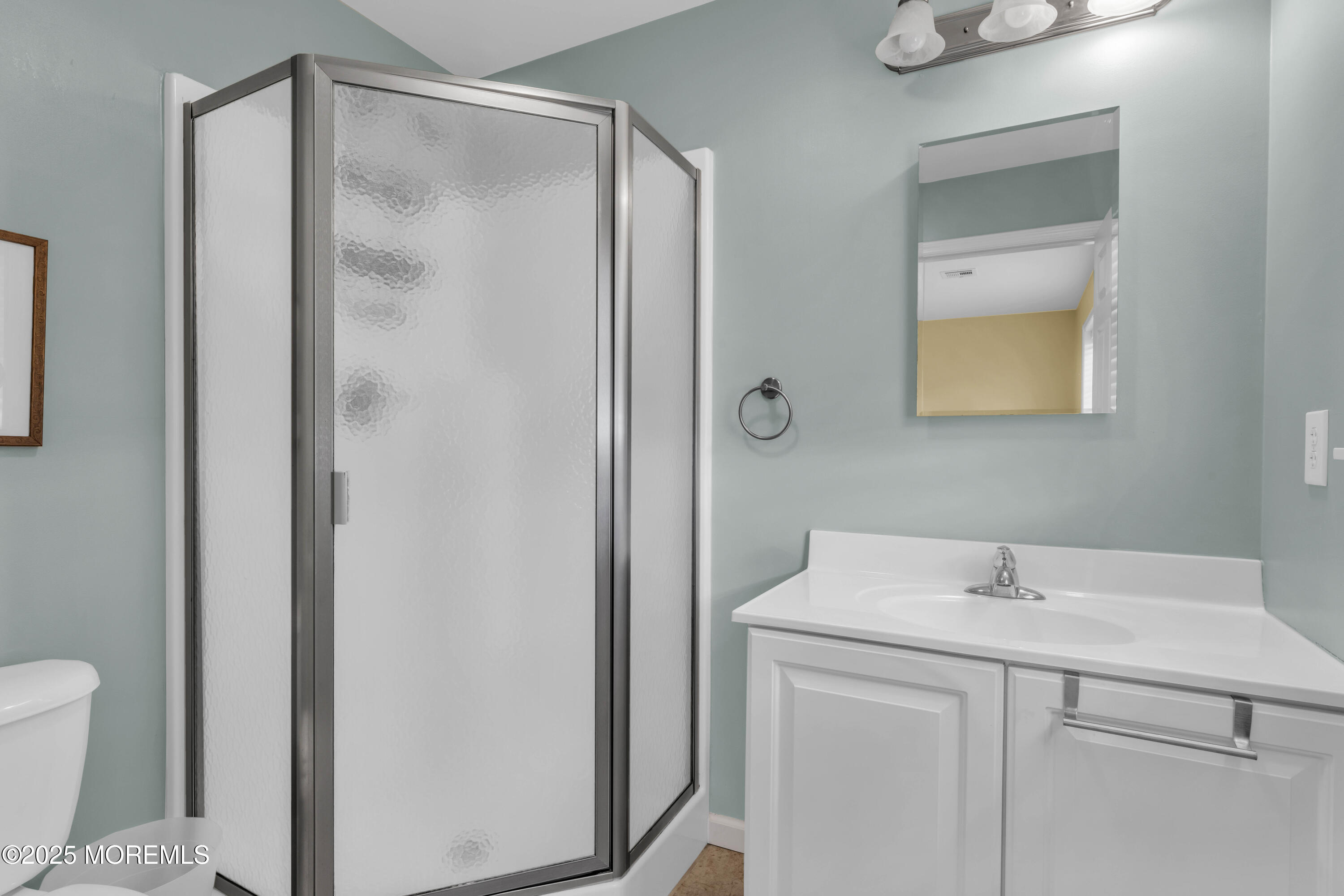 111 7th Avenue Seaside Park, NJ 08752 - Photo 34 of 46 a bathroom with a shower sink and mirror