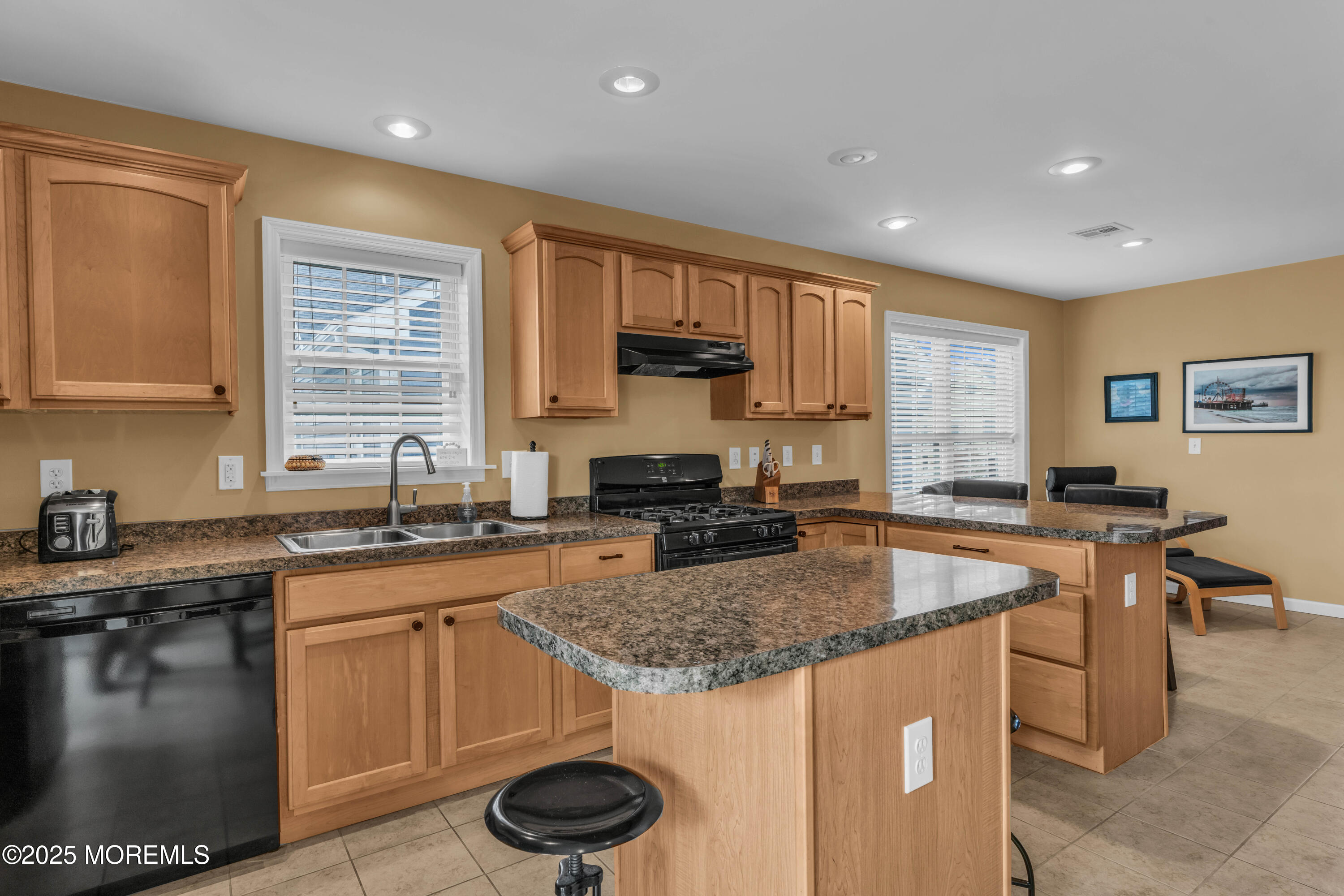 111 7th Avenue Seaside Park, NJ 08752 - Photo 39 of 46 a kitchen with a sink stove and cabinets